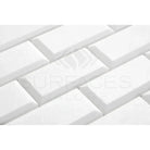 White beveled subway tiles from Thassos Supreme 2X4 Deep-Beveled Brick Mosaic Marble