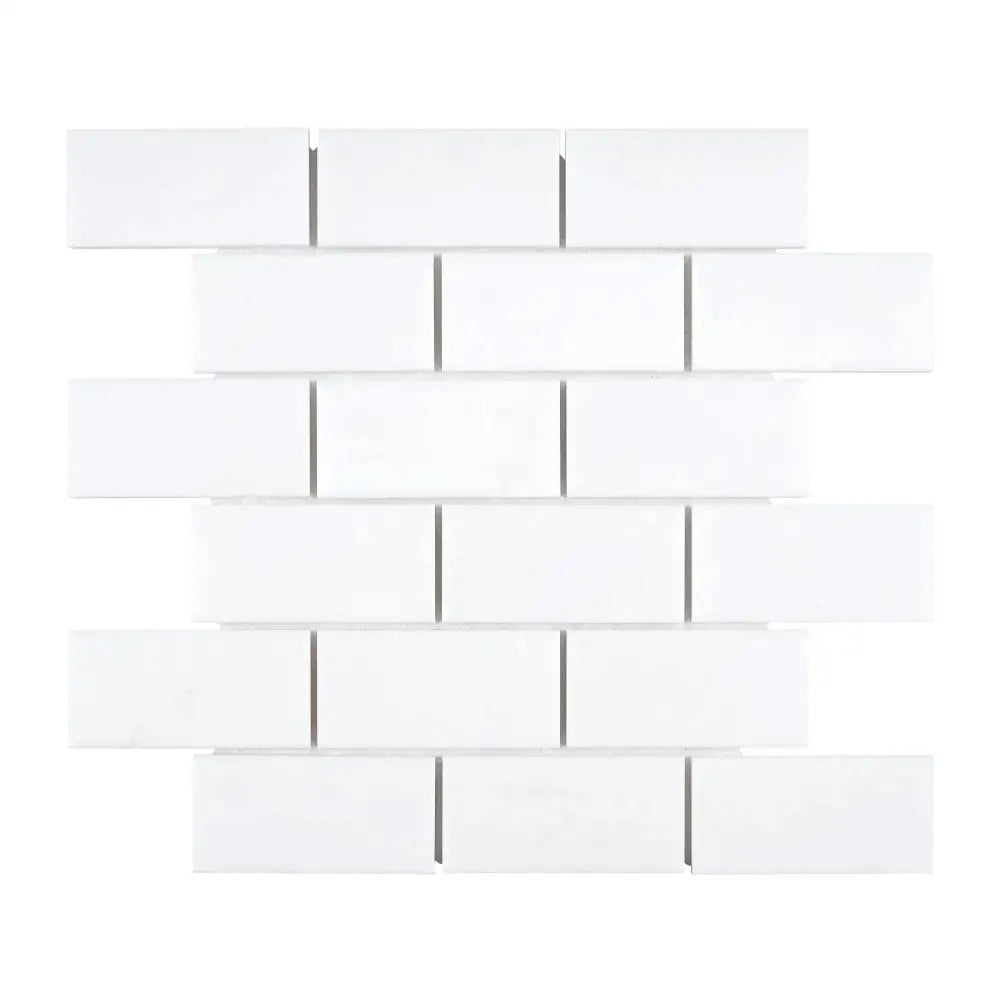 White rectangular tile mosaic from Thassos Supreme 2x4 straight-edged brick marble