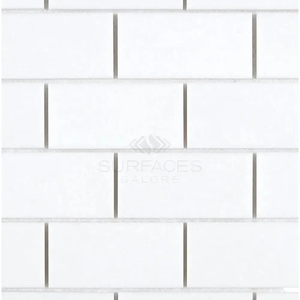 White subway tile pattern on Thassos Supreme 2x4 mosaic marble for wall or backsplash