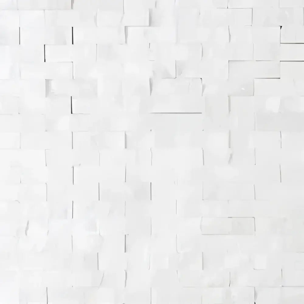White brick wall featuring Thassos Supreme 3/8X1 Mini-Brick Mosaic Marble Split-Faced