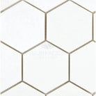 White hexagon tile pattern featuring Thassos Supreme 3-inch marble mosaic