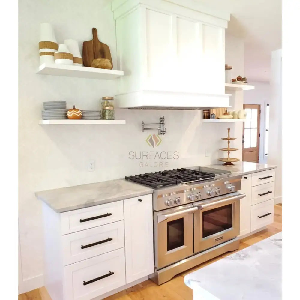 Stainless steel double oven range from Thassos Supreme 3X6 Marble Tumbled collection