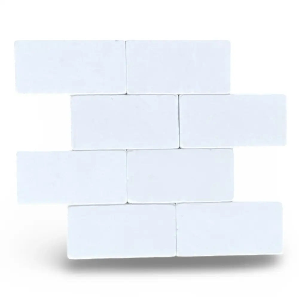 White rectangular blocks of Thassos Supreme 3X6 Marble Tumbled for flooring or walls