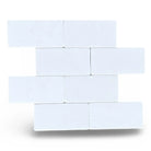 White rectangular blocks of Thassos Supreme 3X6 Marble Tumbled for flooring or walls