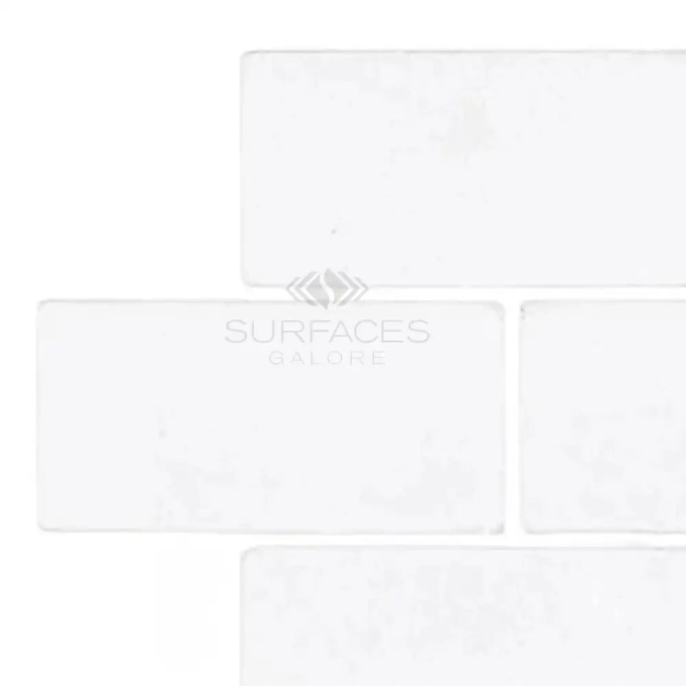 White rectangular Thassos Supreme 3X6 Marble Tumbled tiles for elegant flooring