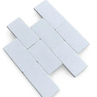 White rectangular Thassos Supreme 3X6 Marble Tumbled tiles for elegant flooring