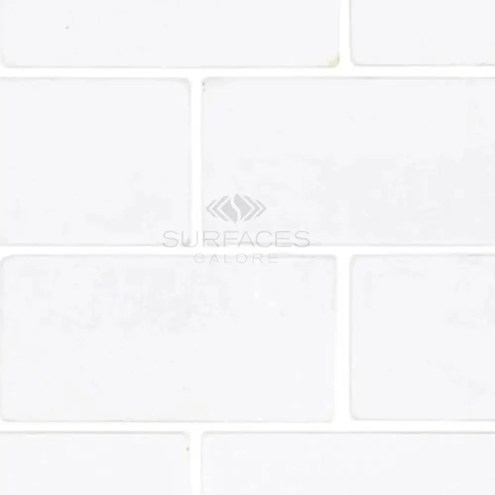White rectangular Thassos Supreme 3x6 Marble Tumbled tiles for elegant flooring