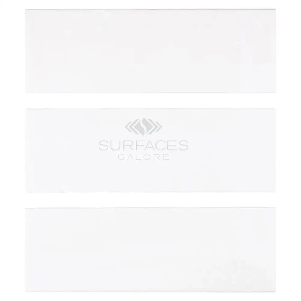 Three white rectangular Thassos Supreme marble tiles with deep-beveled edges
