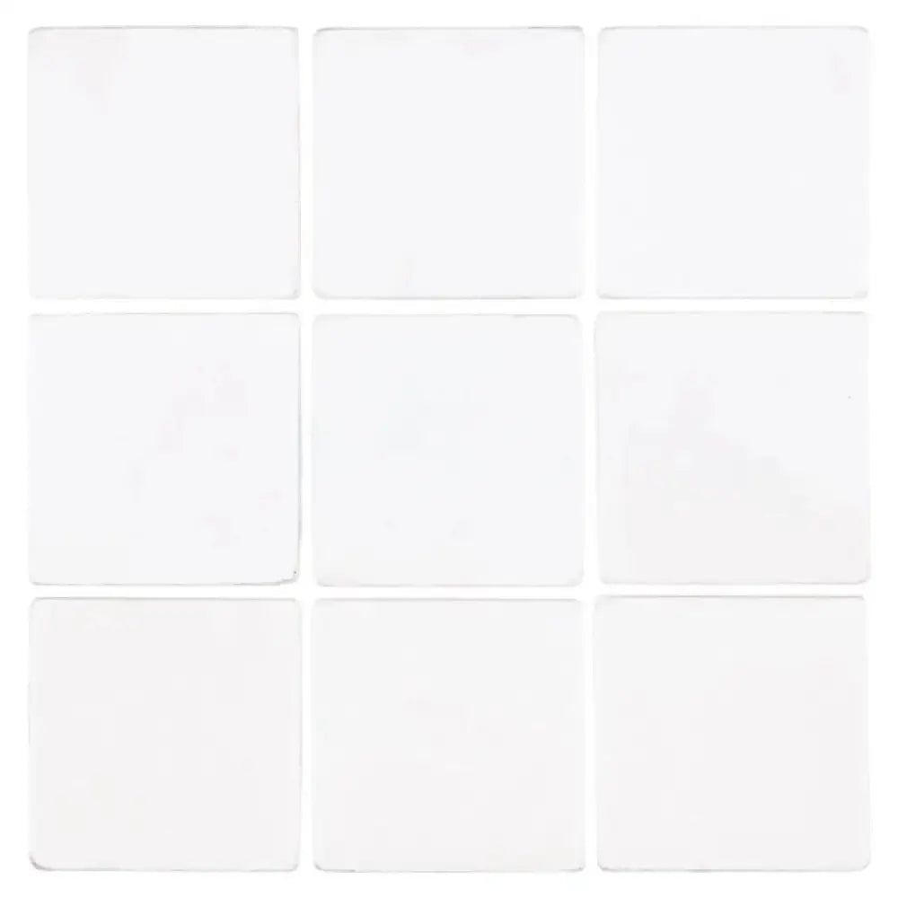 Nine white square Thassos Supreme 4X4 Marble Tumbled tiles for flooring and decor