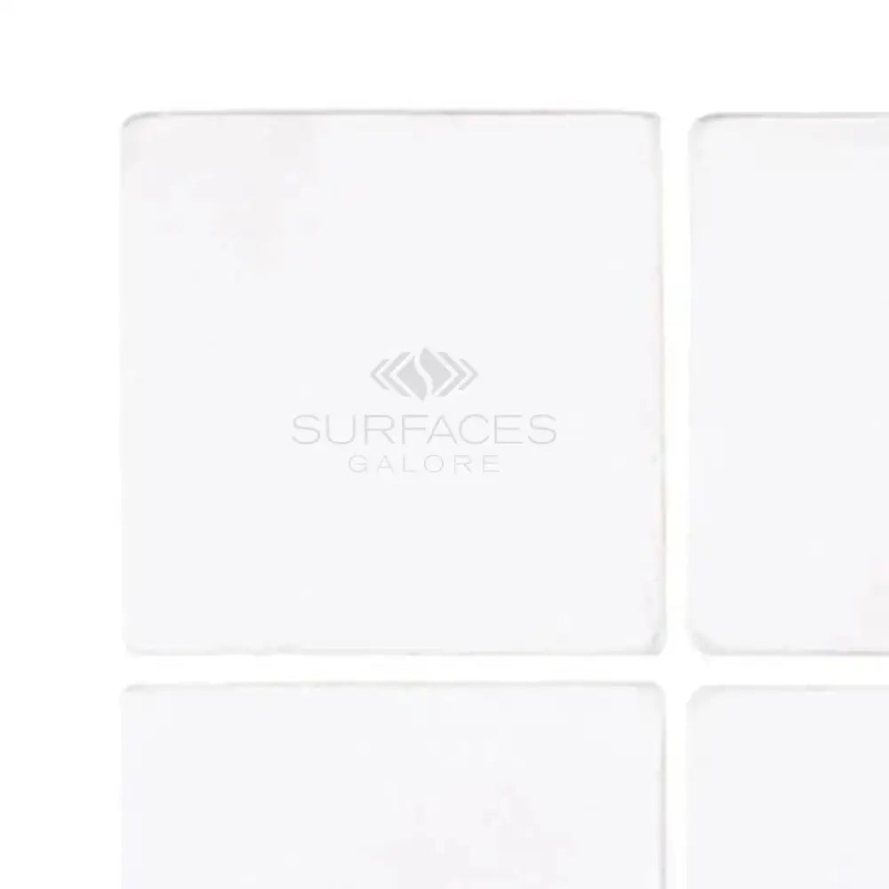 White square tiles from Thassos Supreme 4X4 Marble Tumbled collection
