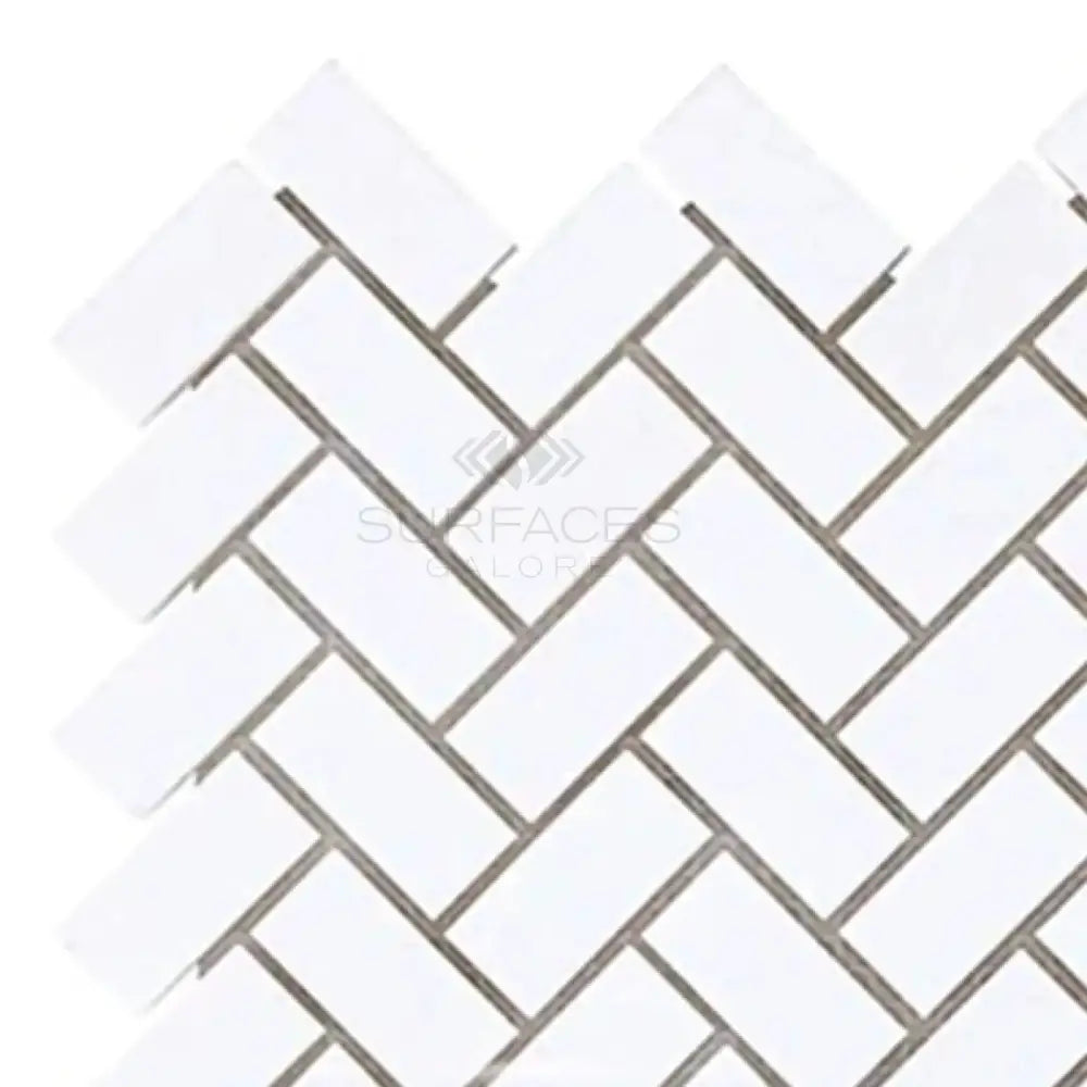 White herringbone tile pattern in Thassos Supreme 5/8X1 1/4 Herringbone Mosaic Marble