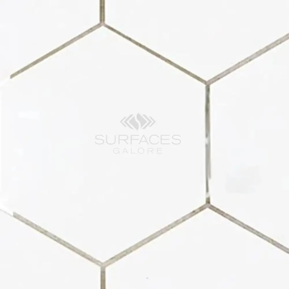 White hexagonal tiles from Thassos Supreme 5 inch Hexagon Mosaic Marble collection