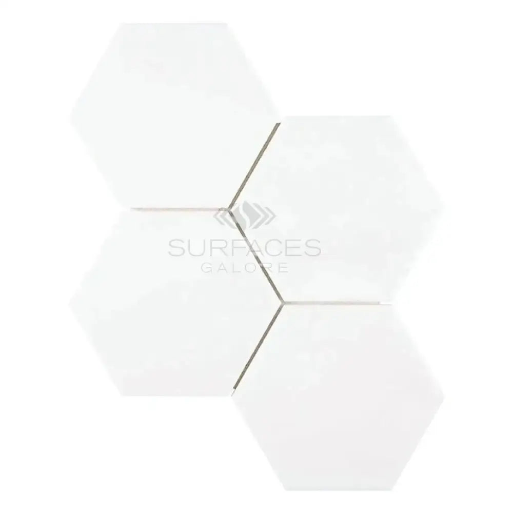 White hexagonal tiles from Thassos Supreme 6-inch Hexagon Mosaic Marble for elegant flooring