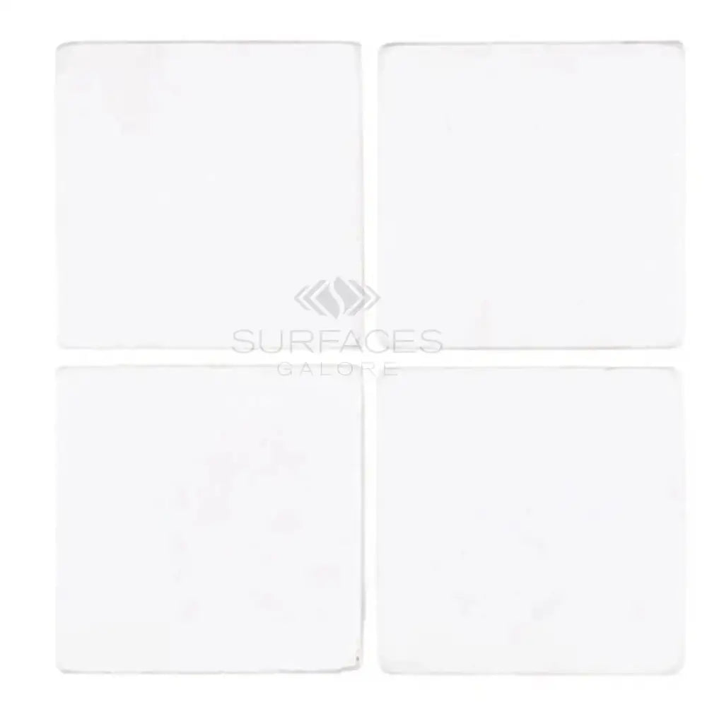 Four white Thassos Supreme 6x6 marble tumbled square tiles for flooring or backsplash