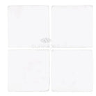 Four white Thassos Supreme 6x6 marble tumbled square tiles for flooring or backsplash