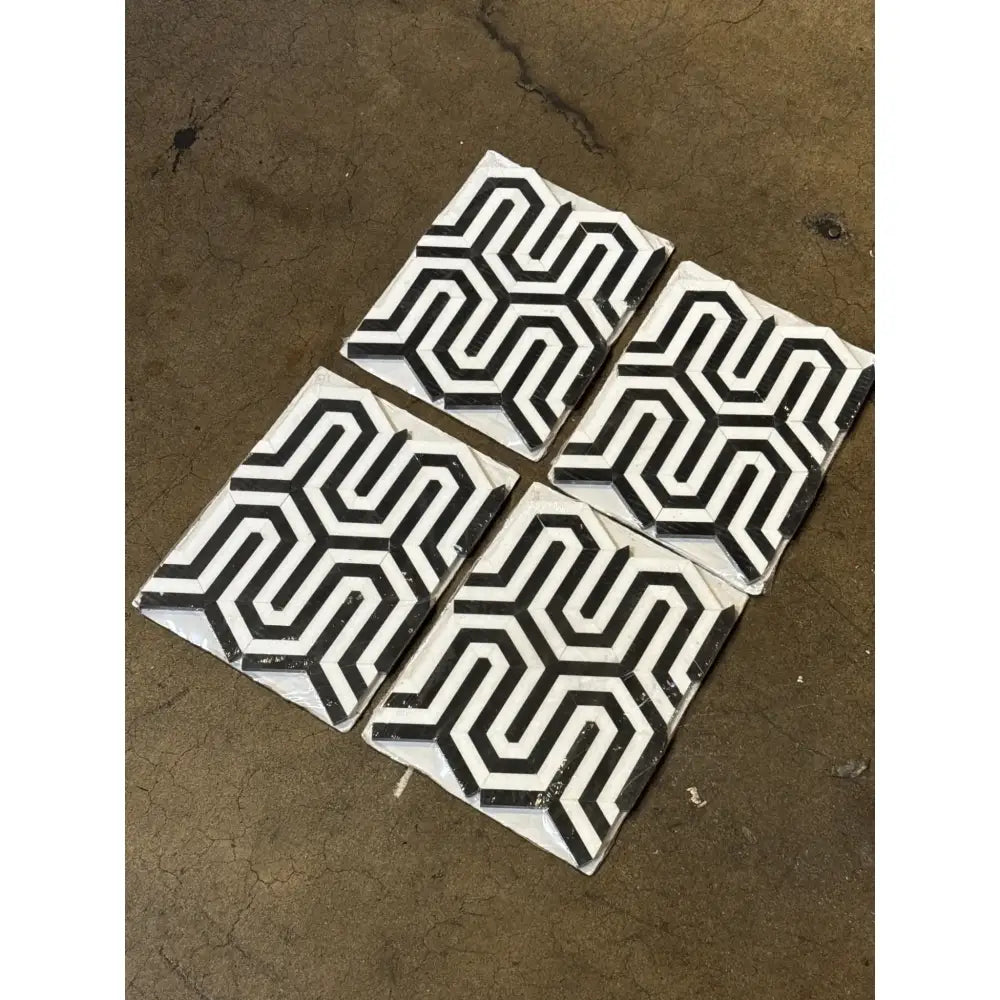 Four black and white patterned tiles from Thassos Supreme Berlinetta Marble Mosaic