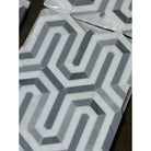 Geometric gray and white tile pattern from Thassos Supreme Berlinetta Mosaic Marble