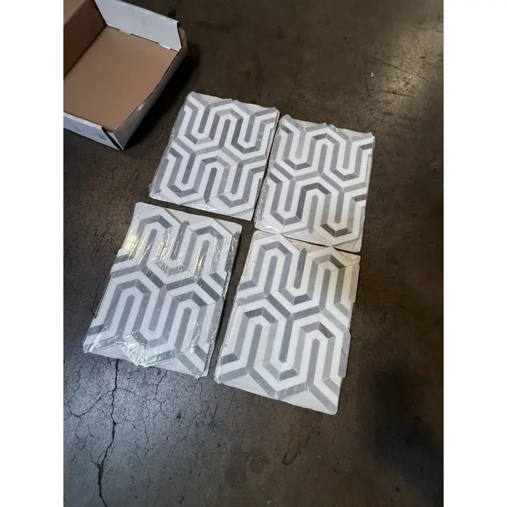 Four patterned Thassos Supreme Berlinetta Design mosaic marble tiles in Blue-Gray finish