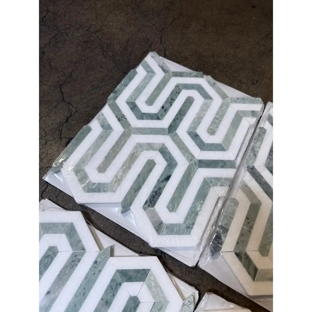 Hexagonal patterned marble tiles in Thassos Supreme Berlinetta Mosaic with Ming Green finish