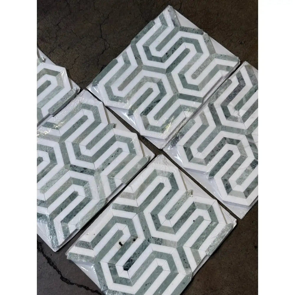 Geometric patterned mosaic tiles from Thassos Supreme Berlinetta Ming Green marble