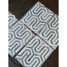 Geometric patterned mosaic tiles from Thassos Supreme Berlinetta Ming Green marble