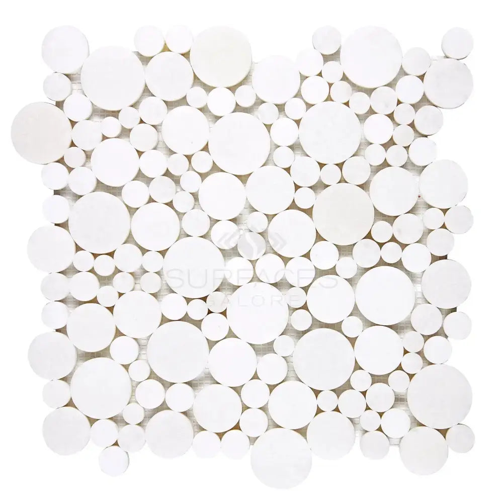 White circular mosaic tile from Thassos Supreme Bubbles Marble collection