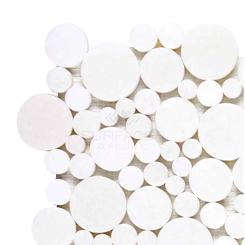 White circular mosaic tile pattern from Thassos Supreme Bubbles Marble collection