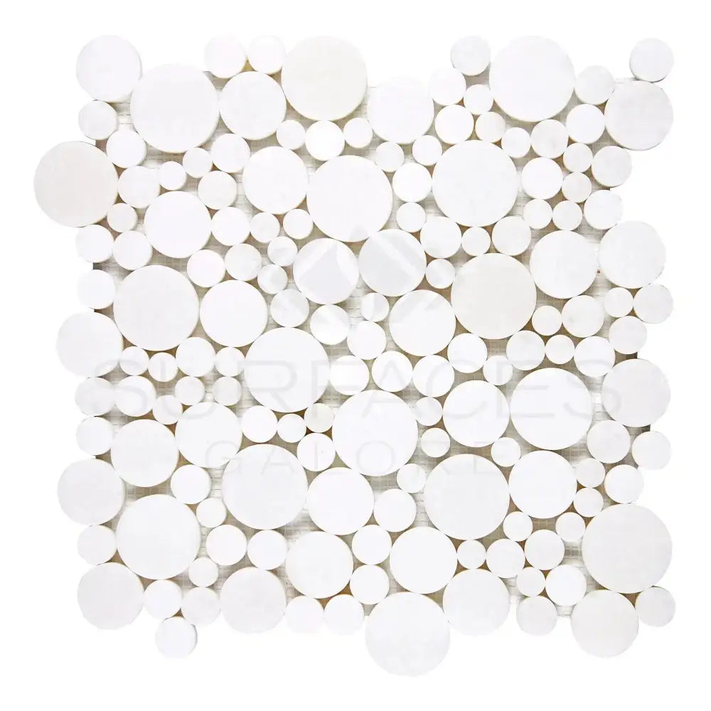 White circular mosaic tile sheet from Thassos Supreme Bubbles Mosaic Marble collection