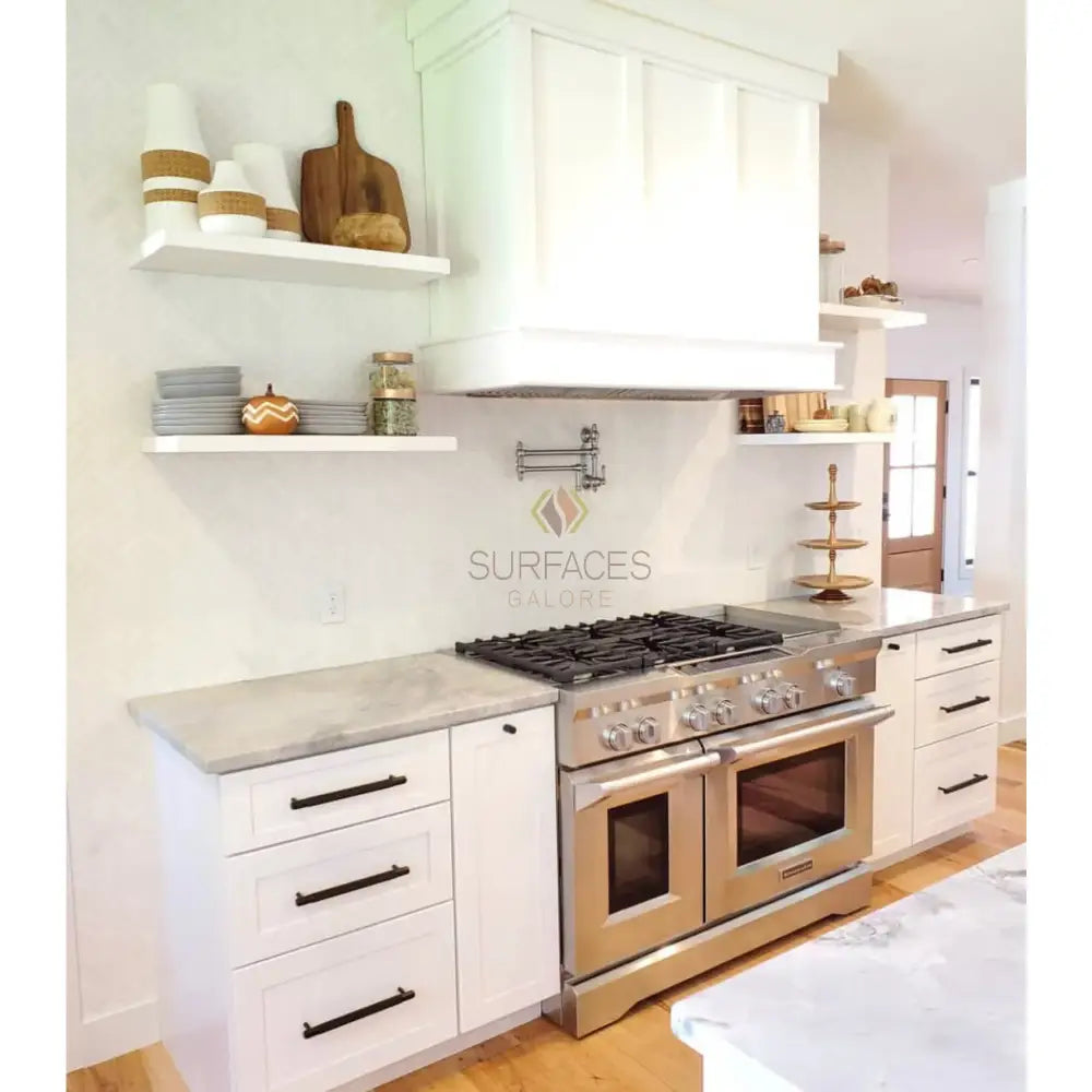 Stainless steel double oven range with Thassos Supreme Pinwheel Mosaic in Blue-Gray
