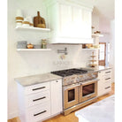 Stainless steel double oven range with Thassos Supreme Pinwheel Mosaic in Blue-Gray